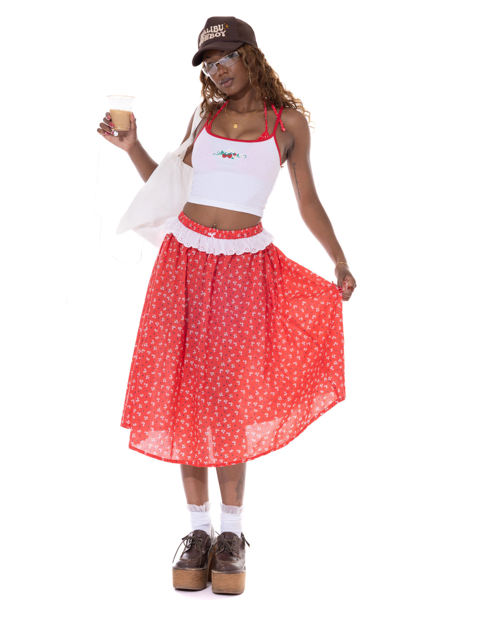 *Kenny is wearing size S and is 5'9" tall, with a 36" bust, 26" waist, and 38" hips.*