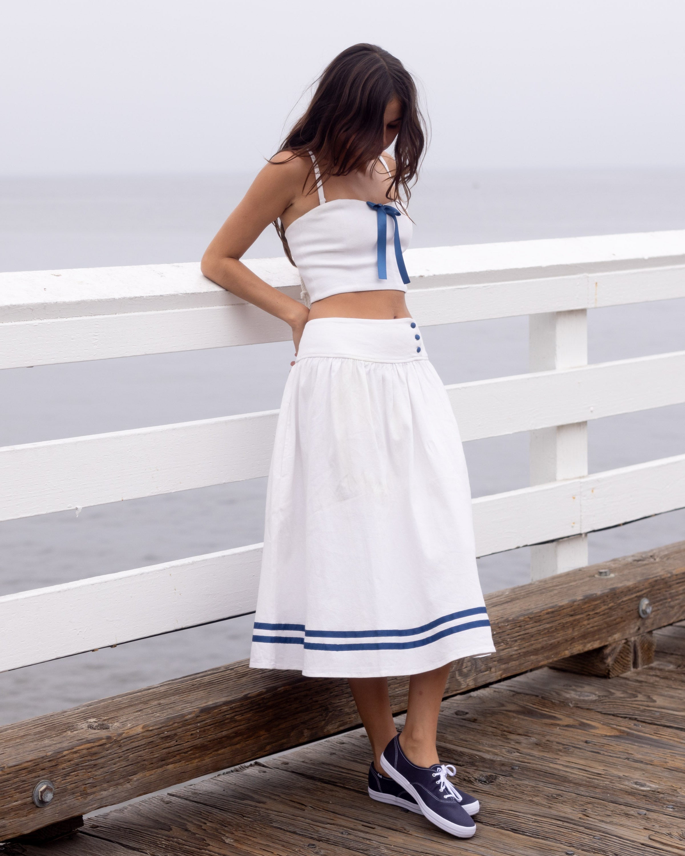 *Emilia is wearing size S and has a 30.5" bust, 24" waist, 36" hips, and is 5'5" tall.*