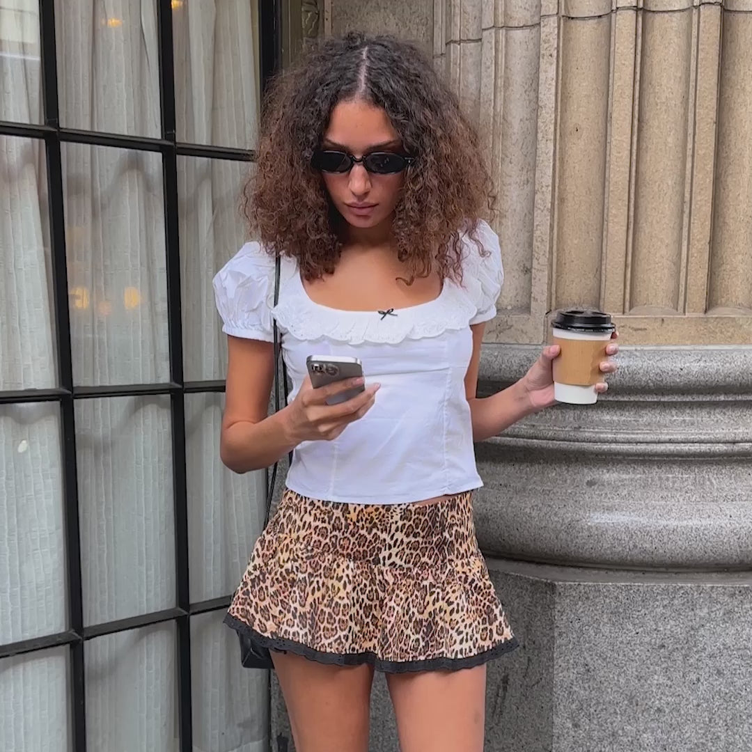 *Carmel is wearing size S and is 5'9" tall, with a 31" bust, 25.5" waist, and 37.5" hips.*